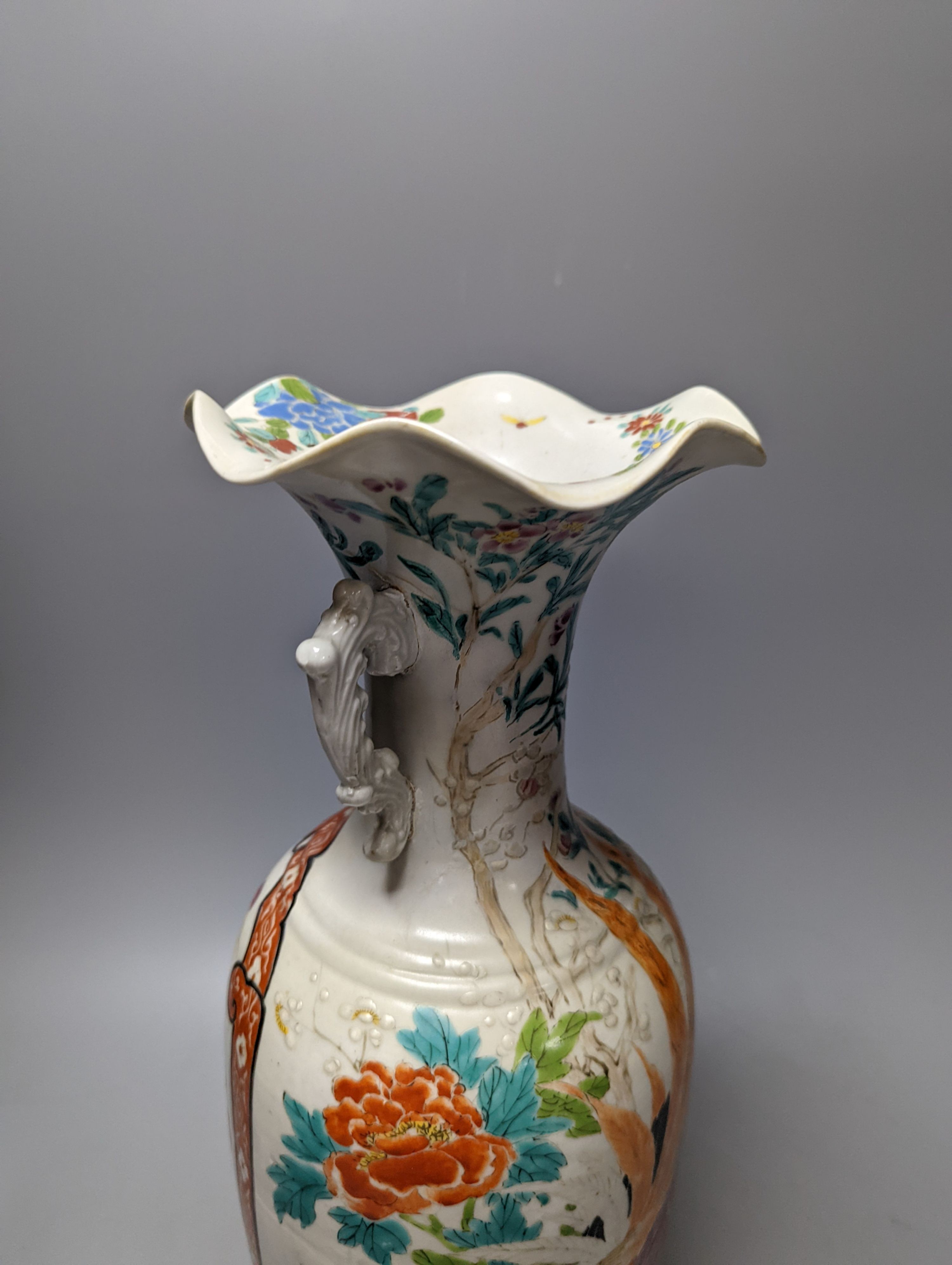 A Chinese famille rose vase and two ginger jars, together with a Japanese vase, 38cm